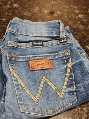 Wrangler Women’s Blue Boot Cut Jeans with Tan Patch